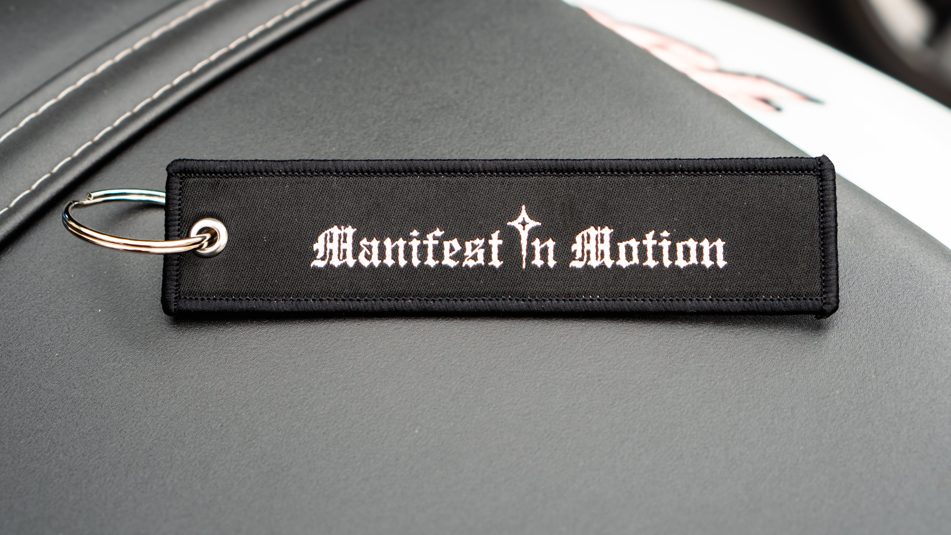 Manifest In Motion Jet Tag